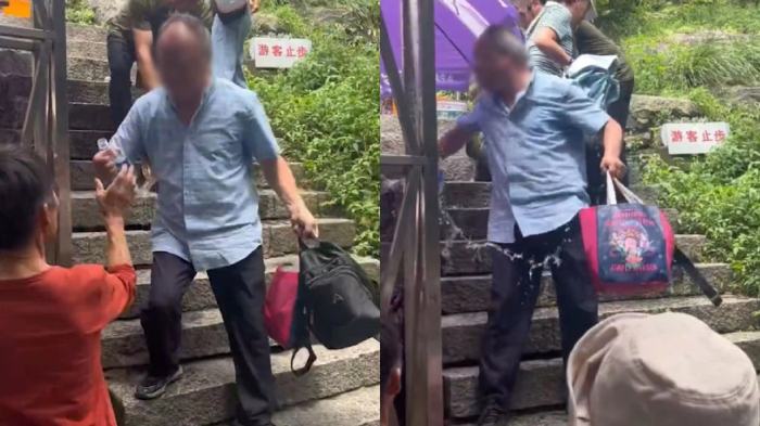 老人坐景区台阶上休息被泼水驱赶
